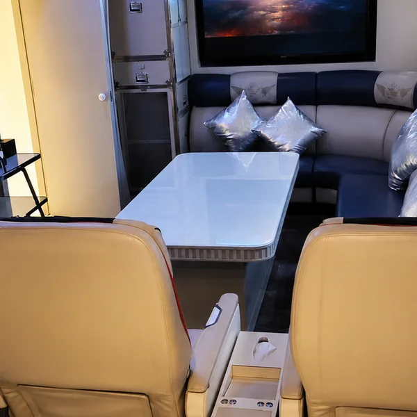 Airplane cabin theme room with seats and screen photo