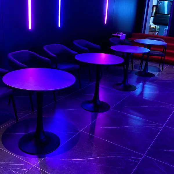 Purple bar and round-table area for drinks photo