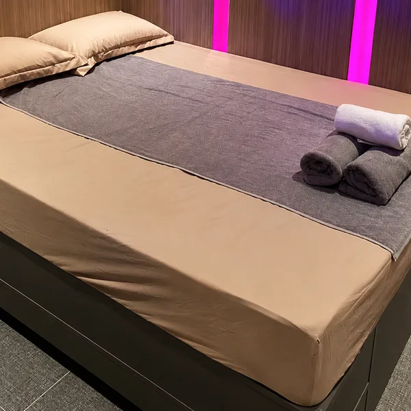 Minimal waterbed room with bed and amenities neatly prepared photo
