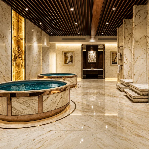 Round soaking pool with gold ceiling and marble walls photo