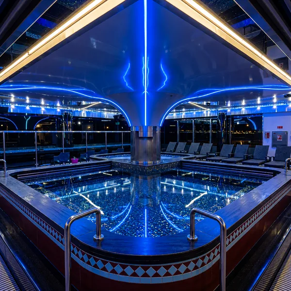 Large blue-lit bathing pool photo