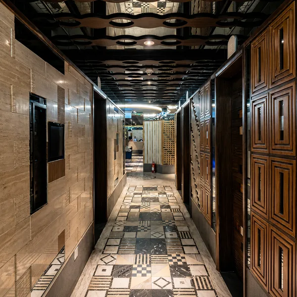 Patterned-tile corridor with a classic club feel and clear routing photo