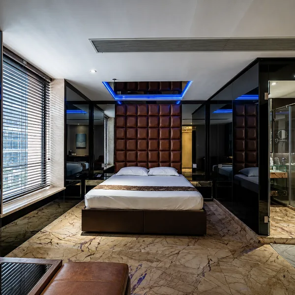 Leather-headboard bedroom photo