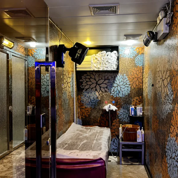 Mosaic waterbed room with dark walls and classic waterbed setup photo