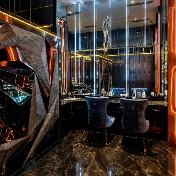 Mirror vanity area with lighting and seating for easier grooming before service photo