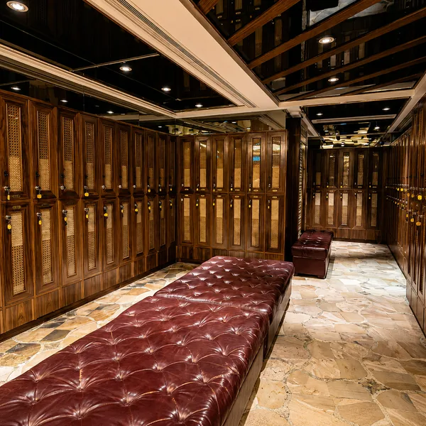 Wood locker room with enough bench space for an easier arrival routine photo