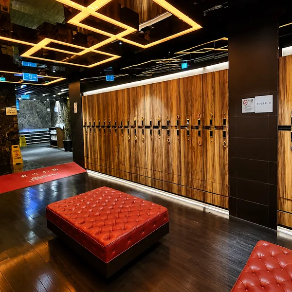 Wood locker room with red bench seating photo