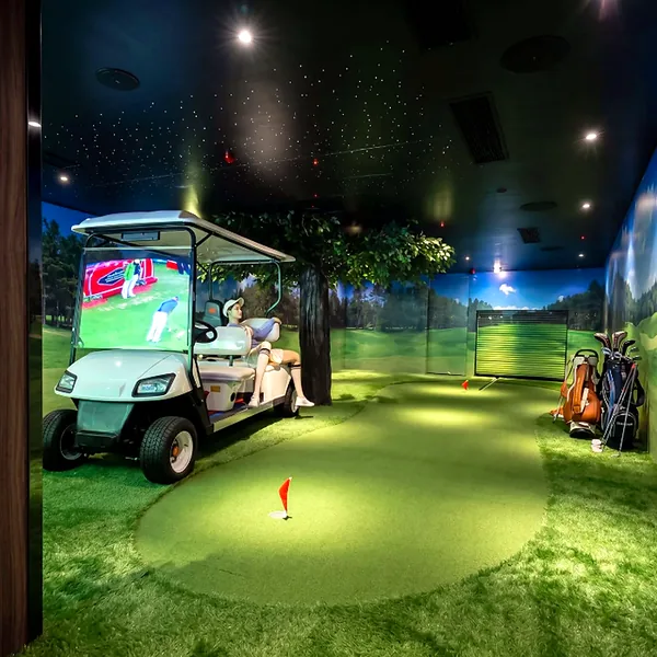 Golf theme room with green and cart setup photo