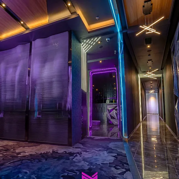 Neon corridor and mirrored entrance photo