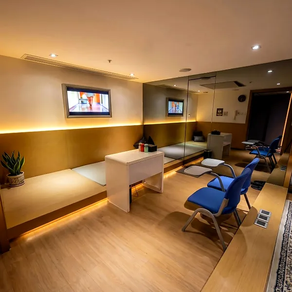 Clinic-style room with a pale interior and projected backdrop for a different story scene photo