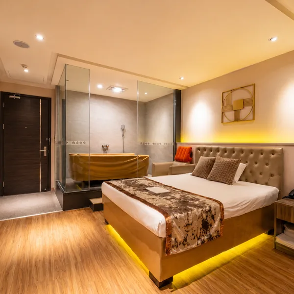 Private bedroom suite with warm lighting and a large bed for better rest quality photo