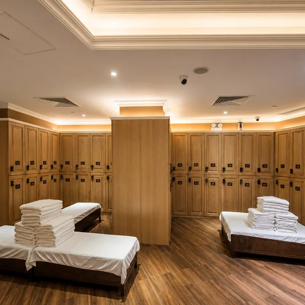 Bright locker room with wood cabinets photo